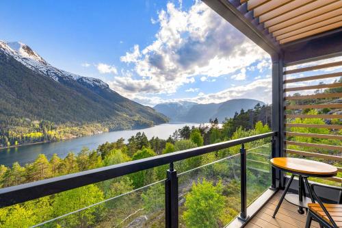 a balcony with a view of a river and mountains at Sogndal Fjordpanorama - The view in Sogndal