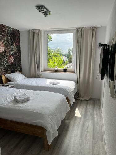 Ένα ή περισσότερα κρεβάτια σε δωμάτιο στο Hannover Messe Apartment