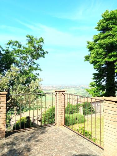 a gate to a balcony with a view at Residenza Messer Pajola in Assisi