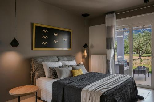 Ένα ή περισσότερα κρεβάτια σε δωμάτιο στο Olea O' Luxury Living