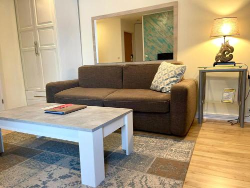 a living room with a couch and a coffee table at Jupiter Hotel in Amsterdam