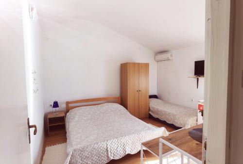 Postel nebo postele na pokoji v ubytování Apartments Bele