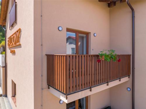 a balcony of a building with a plant on it at Penzion Balcony in Český Krumlov