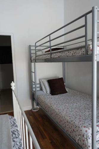 a bedroom with two bunk beds with a pillow at Olive Branch El Chorro in El Chorro