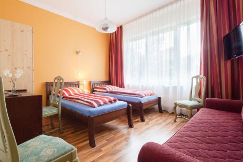 Cama o camas de una habitación en Hotel Marco Polo