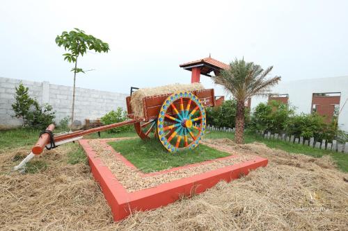 a statue of a cart with a load of hay at AS Garden Villa in Ranipet