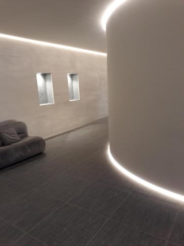 a room with a couch in a room with lights at Hotel Palace in Varazze