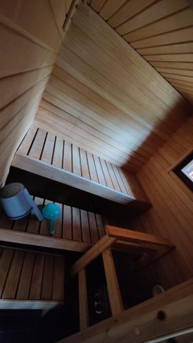 a ceiling of a wooden cabin with a roof at Maatilamatkailu Jänisvaara in Kolinkylä