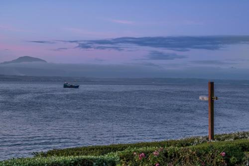 a boat in the middle of the water at Beacon Wharf , George Hay 6 Seafront Accommodation in Mossel Bay