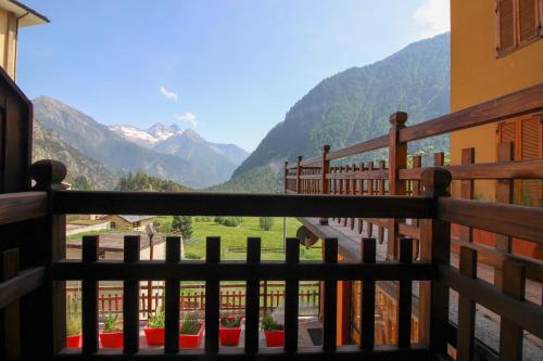 a view from a balcony with a view of mountains at Residence Aquila - Bilo Monte Rena in Brusson