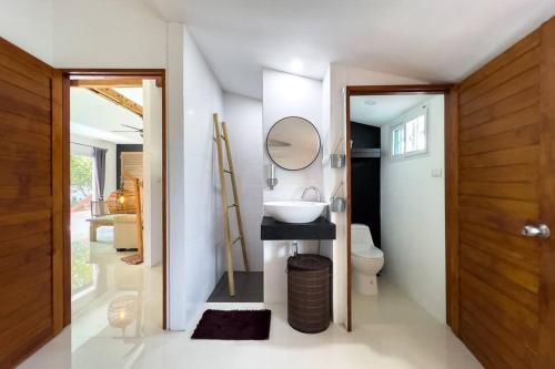 a bathroom with a sink and a mirror at Pool Villa Bangrak, 2 mins to beach!!!! in Koh Samui 