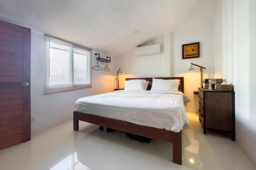 A bed or beds in a room at Pool Villa Bangrak, 2 mins to beach!!!!