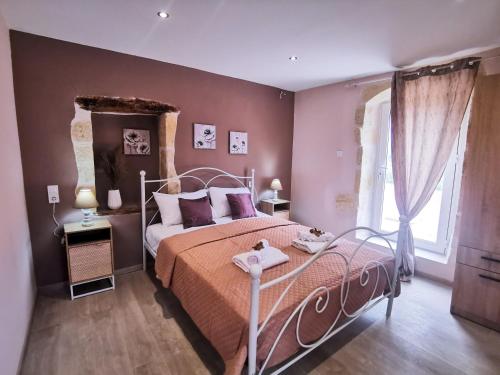 a bedroom with a bed with pink walls and a window at Rocky Mountain Villa in Ramní