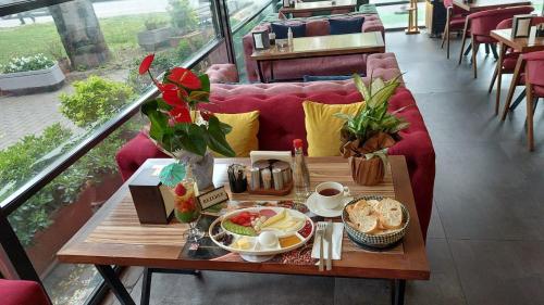 a coffee table with food on it in a restaurant at PARIS HOTEL CAFE RESTAURANT in Istanbul