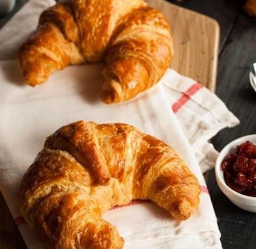two croissants on a napkin on a table at CASA VACANZA LA VILLA in Amelia