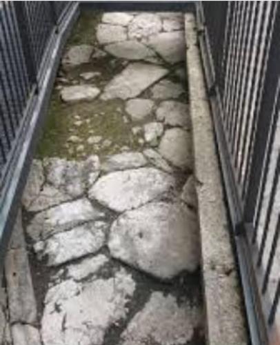 a cage with a bunch of rocks and water at CASA VACANZA LA VILLA in Amelia