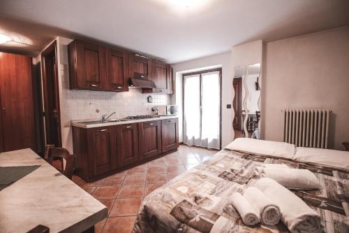 Postel nebo postele na pokoji v ubytování Residence Aquila - Mono Punta Valnera