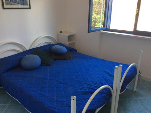 Postel nebo postele na pokoji v ubytování Villa alle Eolie nello splendido Villaggio Lentia