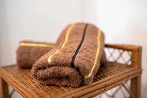 a pile of towels sitting on a wooden bench at Studio LUKA in Rovinj