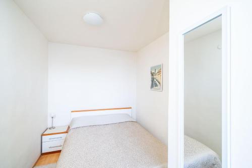 Postel nebo postele na pokoji v ubytování Apartment Bakus