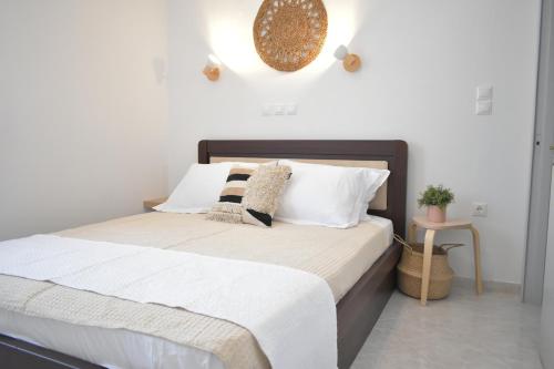 Postel nebo postele na pokoji v ubytování ΘΈΑ - THEA Olympos Karpathos