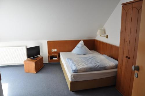 Postel nebo postele na pokoji v ubytování Hotel Elxleben
