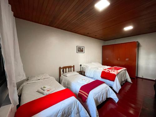 Ένα ή περισσότερα κρεβάτια σε δωμάτιο στο Pousada Caminhos Da Neve
