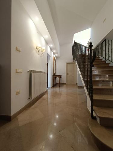 an empty hallway with stairs and a stair case at B&B Estea Tropea in Tropea