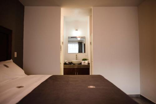 Cama o camas de una habitación en Hotel RM Avandaro