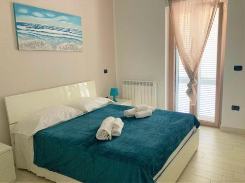 Posteľ alebo postele v izbe v ubytovaní La Casa del Mare