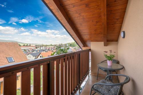 a balcony with a table and a view of the city at Penzion Balcony in Český Krumlov