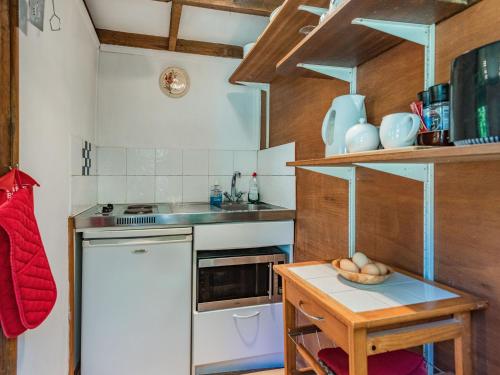 a kitchen with a table with a bowl of food on it at Endymion in Fritham