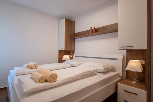 Postel nebo postele na pokoji v ubytování Apartments Mandre