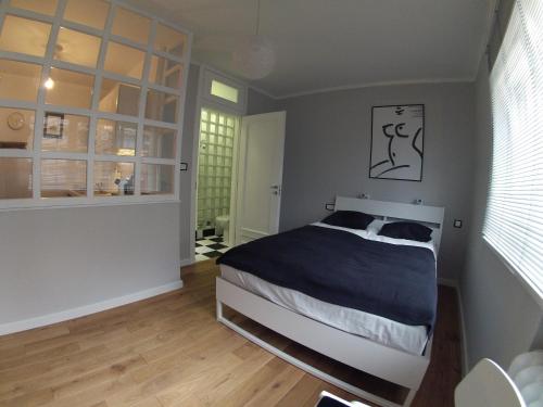 Posteľ alebo postele v izbe v ubytovaní Apartament Black & White w Centrum Gdyni III