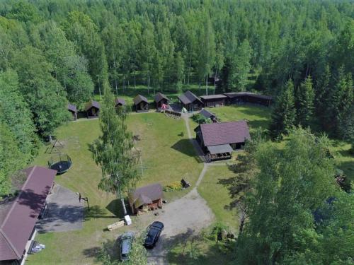 an aerial view of a group of cottages in a forest at Atsikivi Puhketalu in Häädemeeste