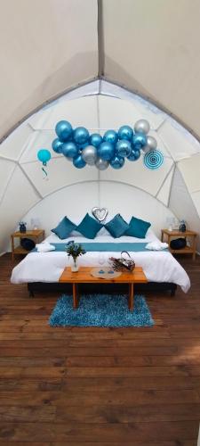 Una cama o camas en una habitación de Origen Glamping en Villa de Leyva