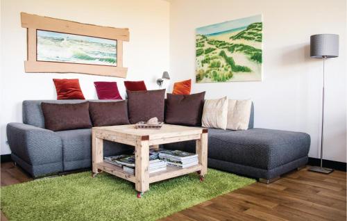 a living room with a couch and a coffee table at Apt 3 Hohen Wieschendorf in Hohen Wieschendorf