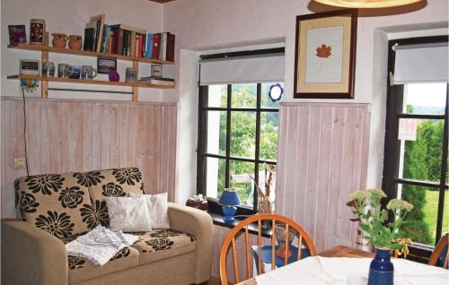 a living room with a couch and a table at Awesome Home In Sassnitz With Kitchen in Sassnitz