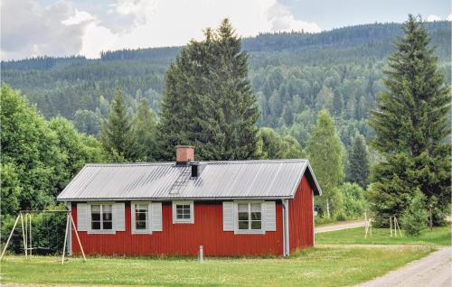 a red house in the middle of a field at 2 Bedroom Stunning Home In Sysslebäck in Sysslebäck