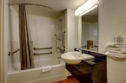 a bathroom with a sink and a shower and a toilet at Motel 6-York, PA - North in York