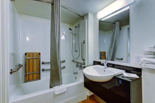 a bathroom with a sink and a shower at Motel 6-York, PA - North in York