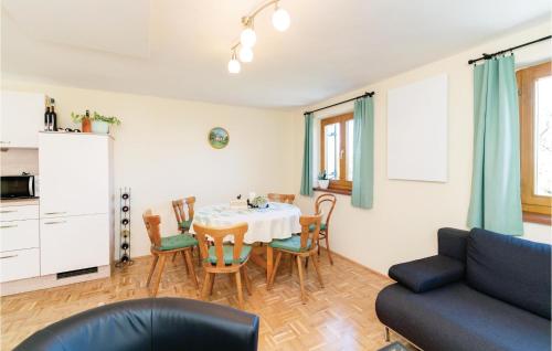a living room with a table and a couch at Schoenes Ferienhaus In Eberau in Eberau