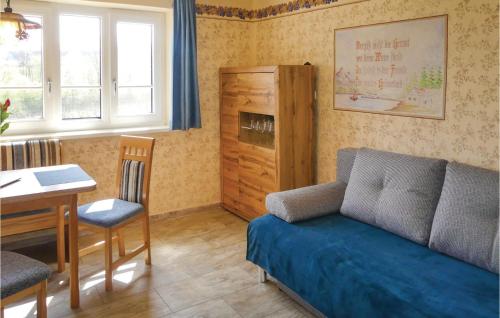 a living room with a couch and a table at Ferienhaus Deutsch Schuetzen in Eisenberg an der Pinka
