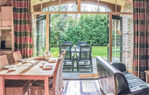 a dining room with a table and chairs at De Haan in IJhorst