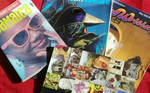 a pile of books with a picture of a woman with sunglasses at The Artist Place Villa at Richmond Estates St Ann in Richmond