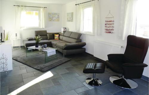 a living room with a couch and chairs and a table at Awesome Apartment In Boiensdorf in Boiensdorf