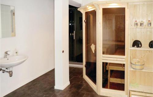 a bathroom with a sink and a glass shower at Nice Home In Auerbach With Wifi in Auerbach