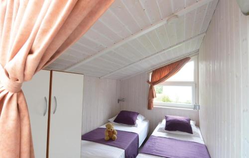 מיטה או מיטות בחדר ב-Freibeuterweg 8 - Dorf 6