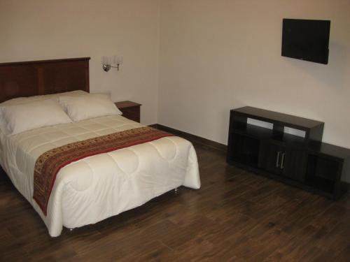 Letto o letti in una camera di Hotel Tito