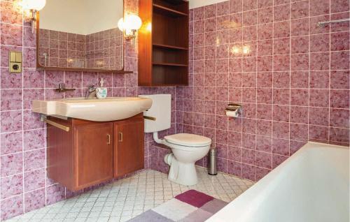 a bathroom with a sink and a toilet and a tub at Awesome Apartment In Hornberg With 2 Bedrooms And Wifi in Hornberg